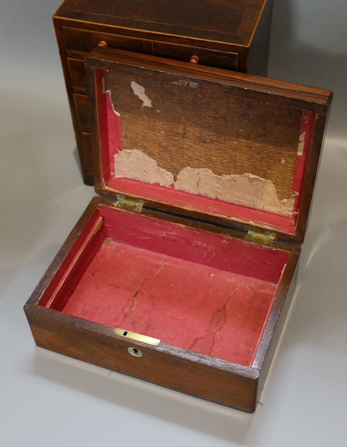 A Victorian rosewood jewellery casket, one other and a 19th century mahogany apprentice chest, height 25cm